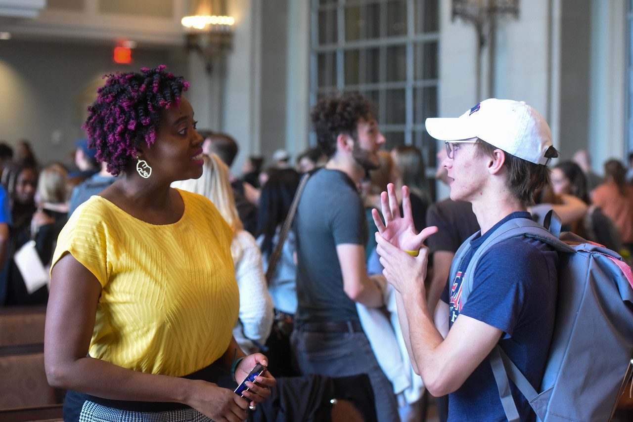 Amena Brown speaks with a student after Chapel