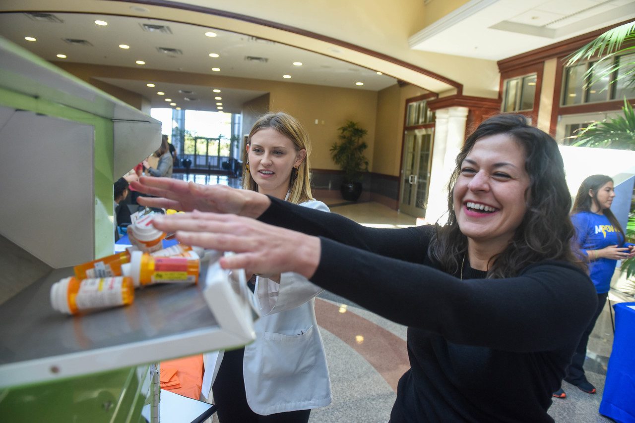 Milwee Assists a Belmont Employee in Dropping Off Unused Medication