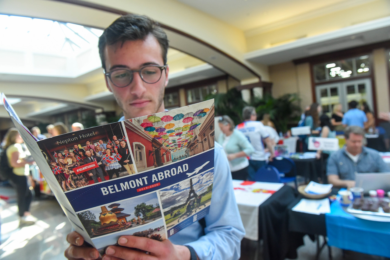 Student Reading Belmont Abroad Brochure