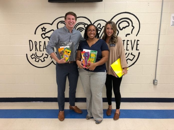 Zack Middleton helps deliver school supplies