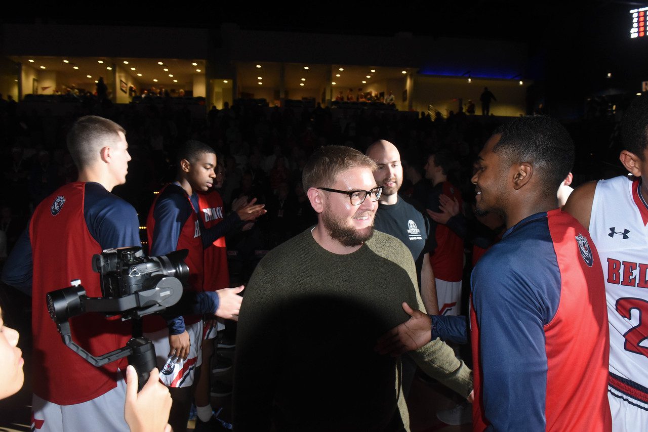 Student Vet Walks Out with Basketball Players