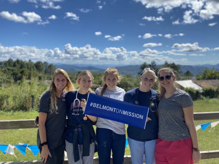 Belmont students hold mission sign in Honduras
