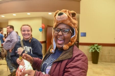 Girl Laughs while wearing Bear Hat