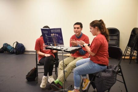 Student practices beat during percussion lesson