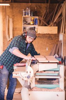 Grant Gill working on furniture