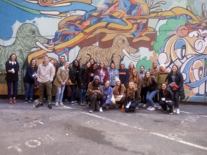 Belmont students with Lindsey Krinks, co-founder of Open Table Nashville and Brian Jones during an urban immersion experience.
