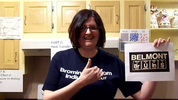 Danielle Garrett holds a Belmont Elements sign in her video