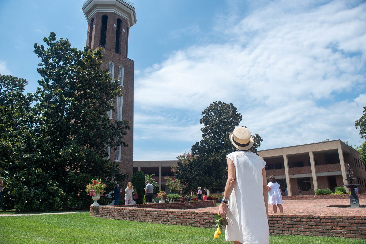 Woman looks up at Bell Tower