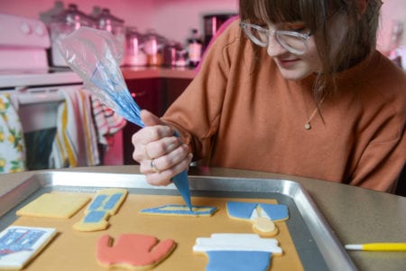 Henegar decorating her sugar cookies