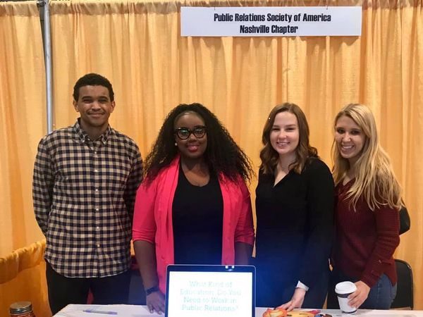 career fair nov 15 2019 music city center L-R, Ian Dinkins and Ivy Johnson of PRSA Nashville, and Olivia Blumb and Jamie Anderson of Belmont PRSSA