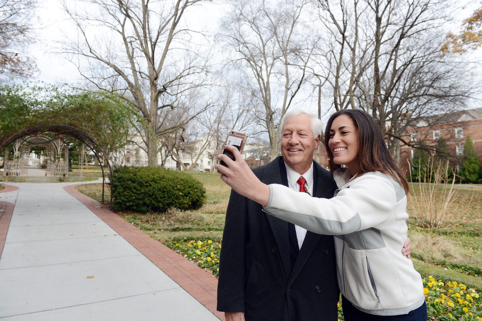Student takes a selfie with Dr. Fisher