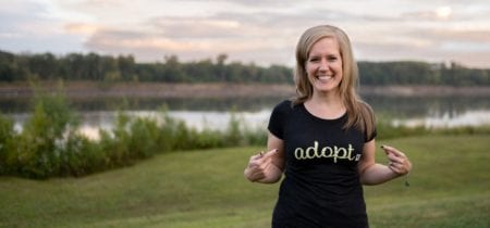 Marcy Bursac wearing shirt that says Adopt