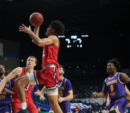 Basketball player shoots the ball