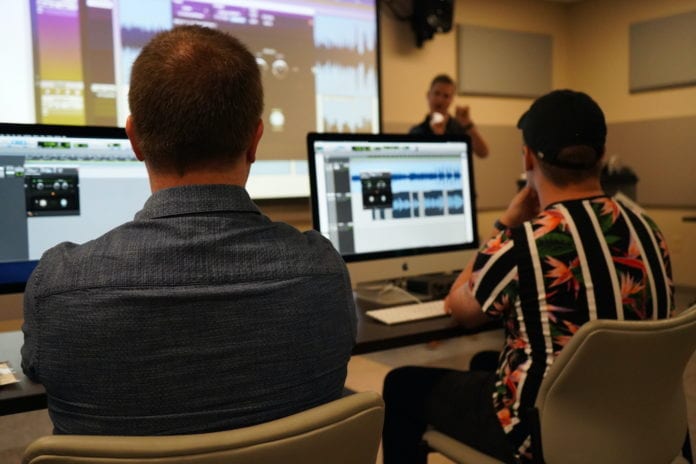 Students and faculty work on Avid software in the Johnson Center.