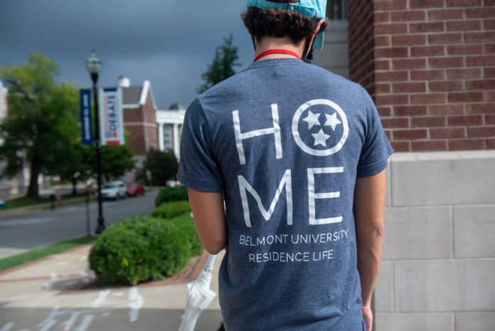 Student wearing T-shirt during Move In that says 'HOME - Belmont University Residence Life