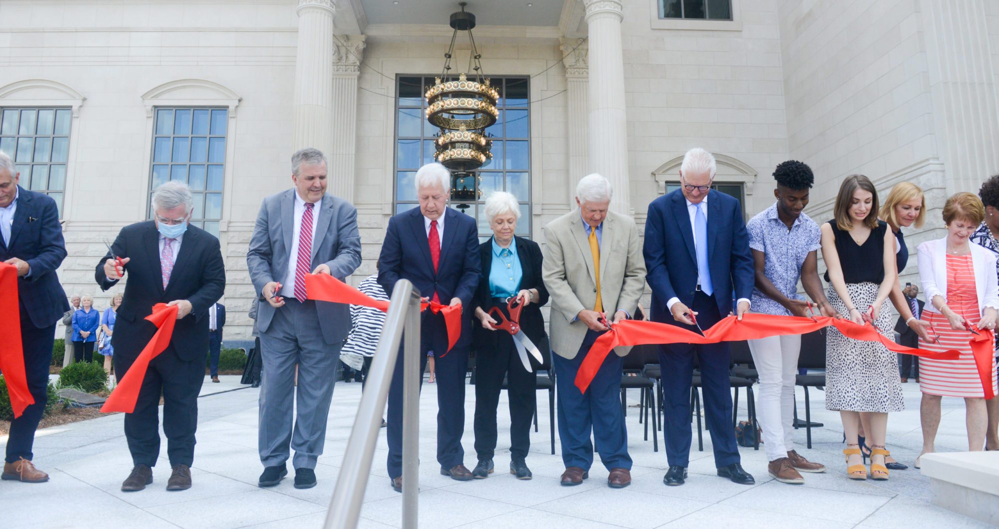 Belmont administrators and students, along with city officials, cut the ribbon today on the new Fisher Center for the Performing Arts. Picture left to right: Butch Spyridon, Mayor John Cooper, Dr. Greg Jones, Dr. Bob Fisher, Judy Fisher, Marty Dickens, Milton Johnson, David Perry, Avery Goodwin, Denice Johnson and Betty Dickens.
