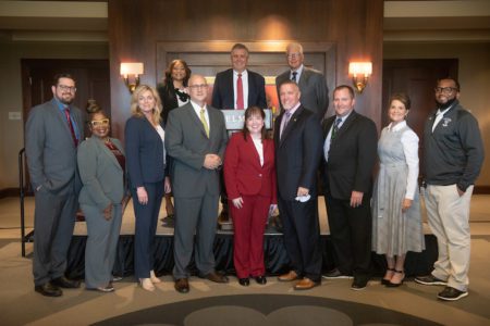 Dr. Adrienne Battle, Dr. Greg Jones and Milton Johnson pose with Metro High School Principals after Belmont announced a significant expansion to its Bridges to Belmont program.
