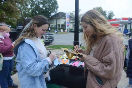 students writing on a ribbon