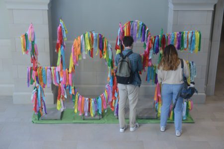 students viewing installation outside of chapel