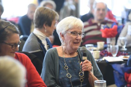 woman speaks into microphone