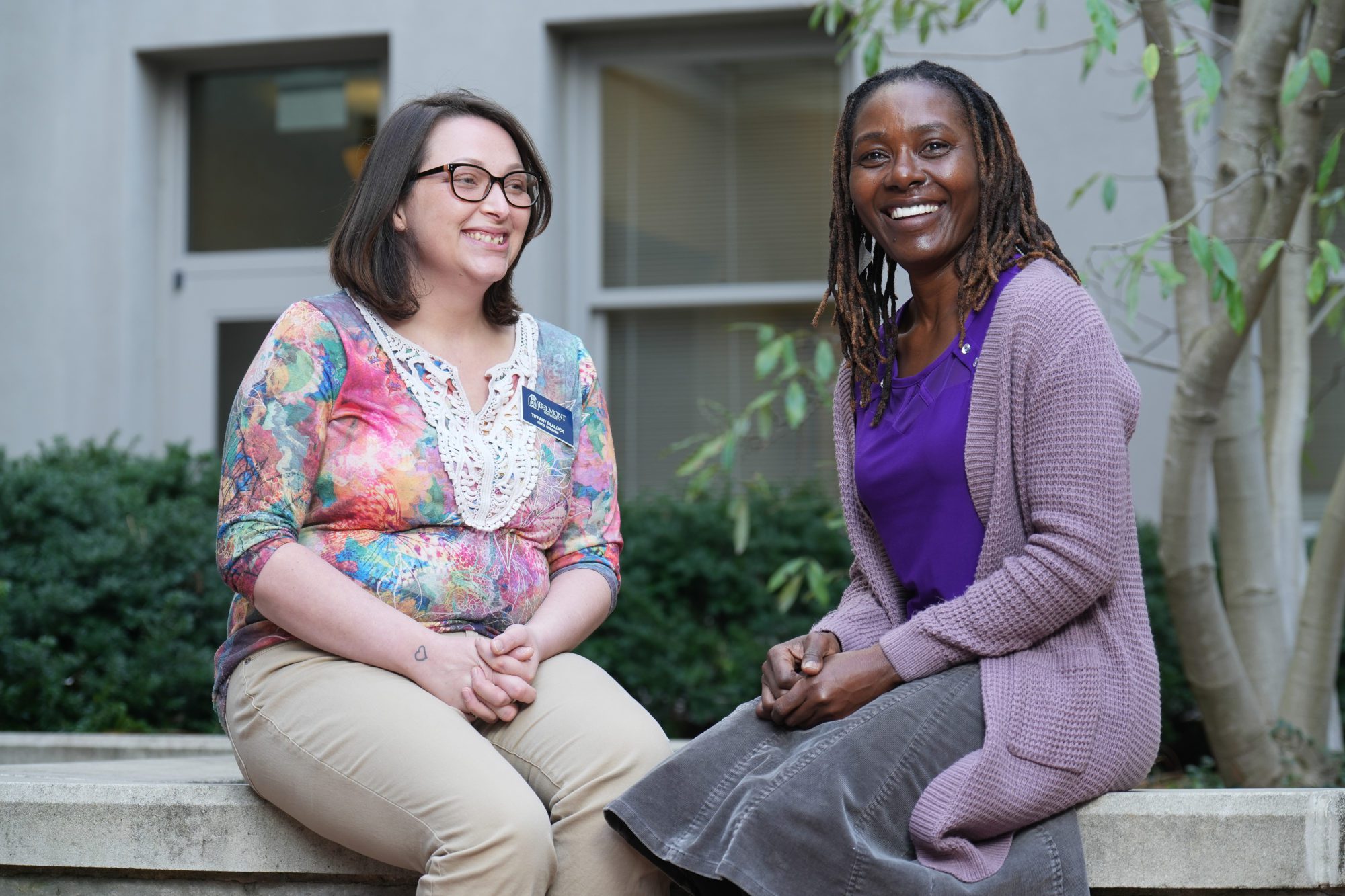 Tiffany Blalock and Dr. Olivia Bahemuka in the courtyard outside the Inman building.