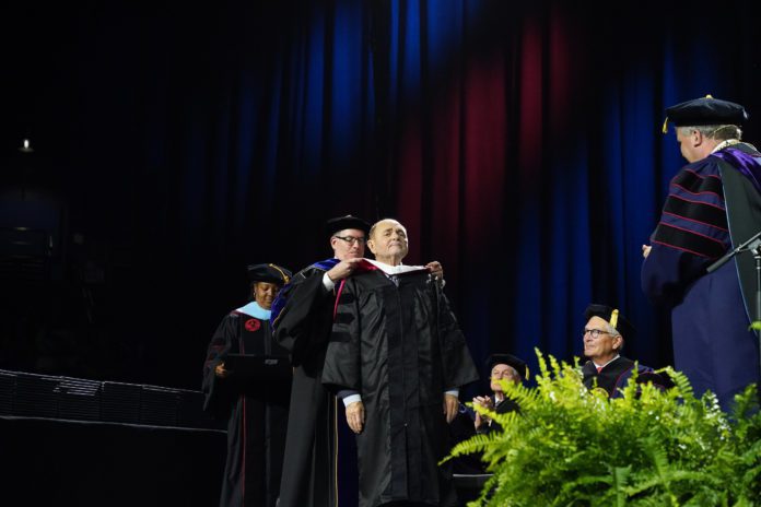 Ayers receiving doctorate