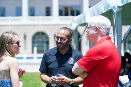 Dr. Edgar Diaz-Cruz talks with alumna