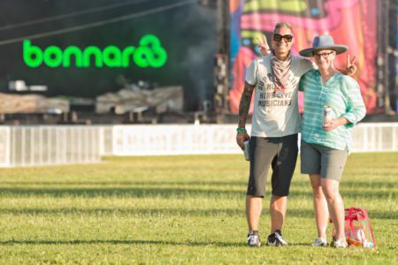 Dr. Ken Spring and Dr. Sarita Stewart stand in front of the Which Stage at Bonnaroo.
