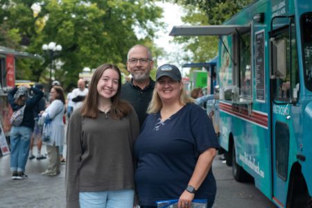 student with family at Festival on the Boulevard