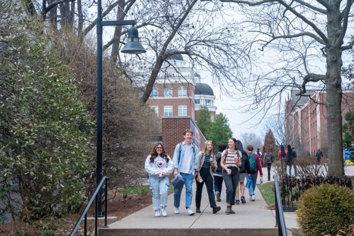 Students walking together on sidewalk