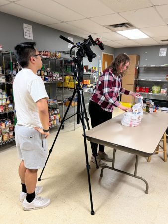 students filming training video