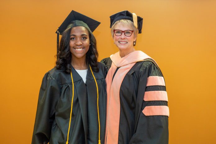 Shakinah McLaughlin poses with Dr. Cathy Taylor at graduation.